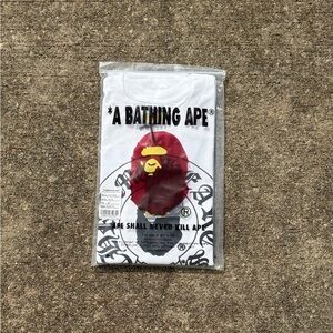 A Bathing Ape White Short-Sleeve Graphic Tee with Red Ape Logo